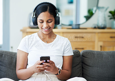 Buy stock photo Home, cellphone and woman with headphones, smile and listening to podcast with live streaming music and sound. Apartment, girl and happy person with headset, tech and smartphone with audio and app