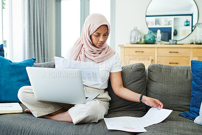 Buy stock photo Muslim woman, laptop and paperwork for remote work on couch, email and freelancer on website in home. Female person, accountant and planning on internet, hijab and research on finance or networking