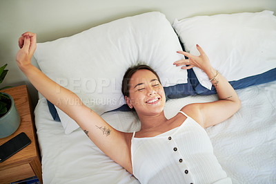 Buy stock photo Woman, home and happy in bed with stretching to rest for break, wellbeing or satisfied. Female person, bedroom and holiday or vacation with day off to relax, chill and calm with wake up and above
