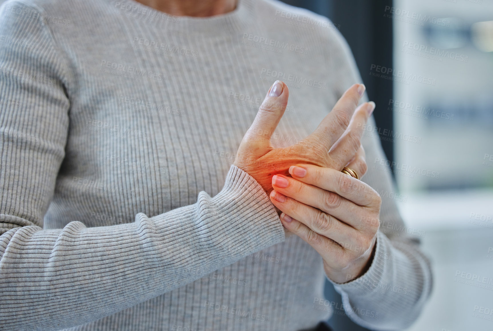 Buy stock photo Mature, hands and pain with injury or arthritis in workplace from person, burnout and red glow in office. Tendinitis, parkinsons and muscle fatigue or carpal tunnel syndrome with inflammation.