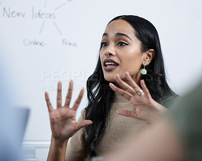 Buy stock photo Shot of a young businesswoman giving a presentation in the office