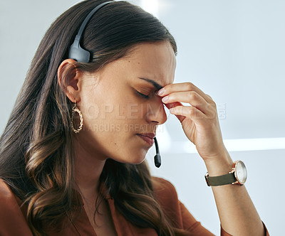 Buy stock photo Mental health, woman with headache and headset at her desk in workplace office. Stress or anxiety, depression and female person with migraine pain at call center or telemarketing workstation.