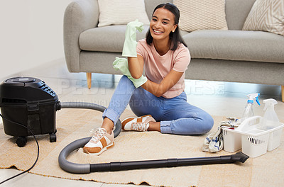 Buy stock photo Vacuum, home and woman portrait with a smile from spring cleaning and tidy living room. Lounge, floor and young female person with happiness from clean rug, housekeeping and maid work on carpet