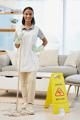 Buy stock photo Shot of a young woman posing with a mop