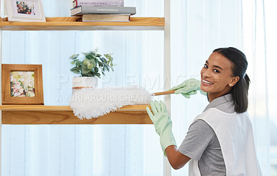 Buy stock photo Shot of a young woman cleaning a surface at home