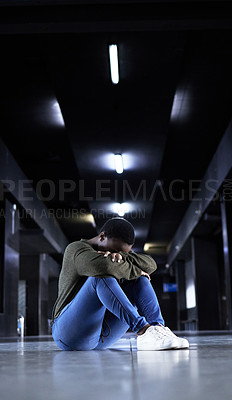 Buy stock photo Woman, depression and sad on floor at train station for bad memory, ptsd or lonely on travel in night. African girl, person and cry at metro terminal with anxiety, lost or stress for future in subway