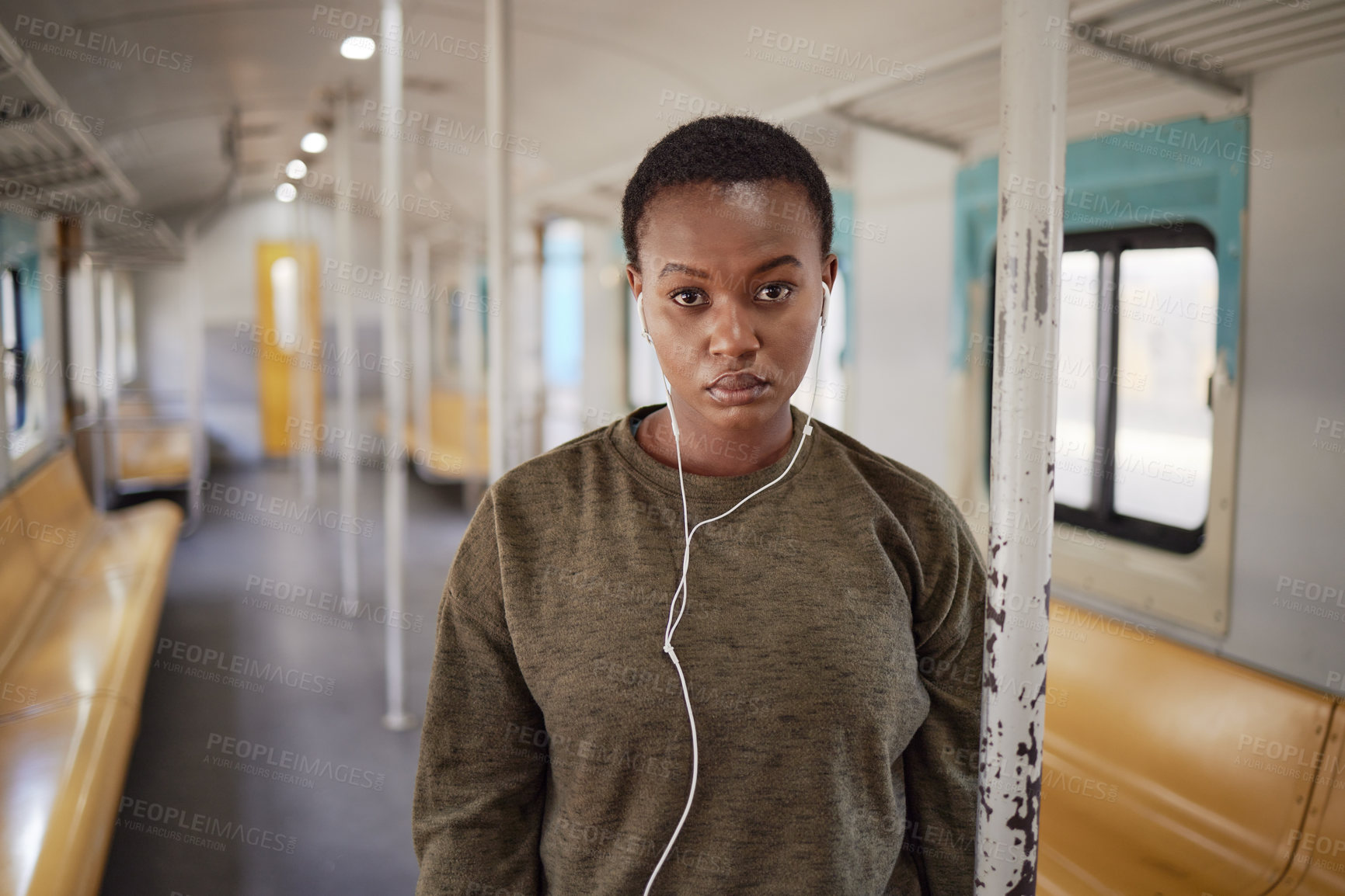 Buy stock photo Woman, portrait and sad in train for travel with earphones, music and lonely on public transport. African girl, person and depressed with anxiety, lost or stress with audio streaming for subway trip