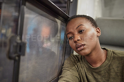 Buy stock photo Woman, travel and depressed by window in train with bad memory, sad and lonely on public transport. African girl, person and tired with anxiety, lost or stress for future in subway on railway journey