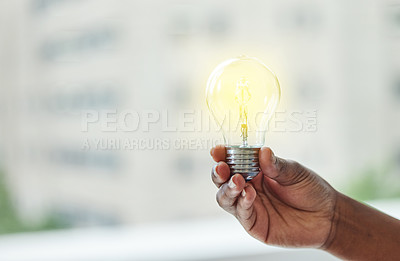 Buy stock photo Shot of an unrecognisable businesswoman holding a lightbulb