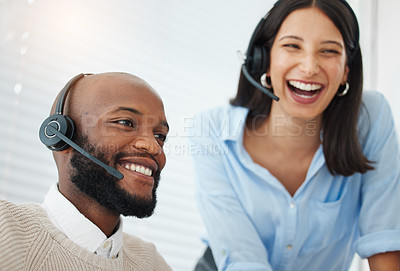 Buy stock photo Shot of a handsome young salesman sitting in the office and wearing a headset while getting help from his manager