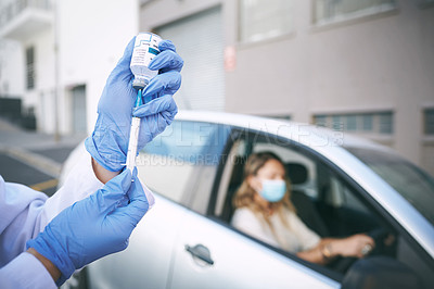 Buy stock photo Shot of a doctor giving a patient an injection at a Covid-19 drive through testing centre