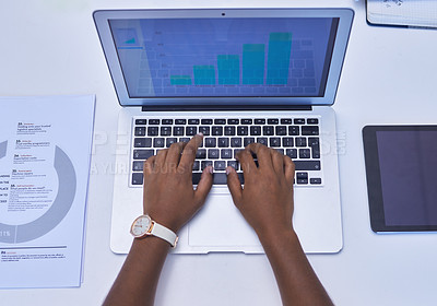 Buy stock photo High angle shot of an unrecognisable businesswoman using a laptop in an office