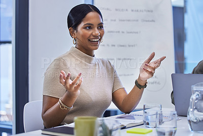 Buy stock photo Shot of a young businesswoman having a meeting with her colleagues in a boardroom