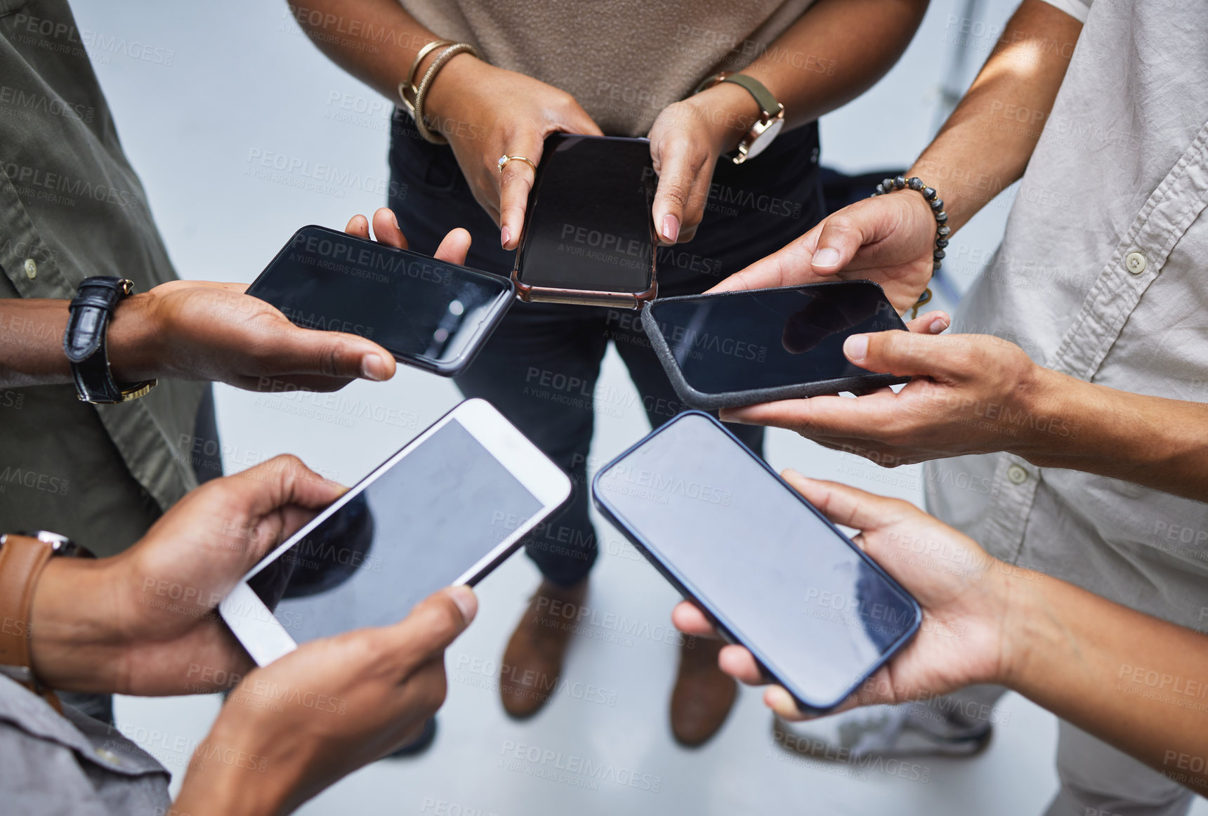 Buy stock photo Group, mockup phone screen and circle of people with mobile app, multimedia network and contact from above. Closeup, hands and team with smartphone technology, digital download and sharing UI data
