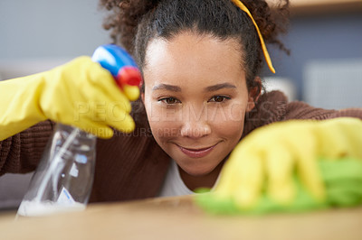 Buy stock photo Home, wipe and woman cleaning, dust and remove bacteria with disinfectant, product and housekeeper. Person, apartment and girl with spray bottle, gloves and cloth for furniture surface and routine