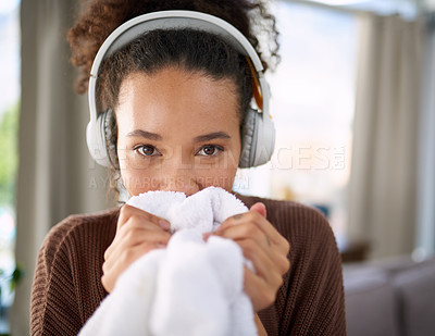 Buy stock photo Smell laundry, woman and headphones for fresh fabric, housekeeping or spring cleaning with audio music. Lady, cloth and podcast for clean linen or streaming sound for hospitality in living room  