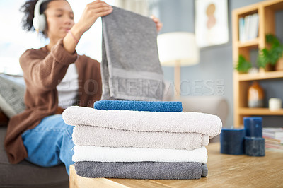 Buy stock photo Cleaning, laundry and towels with woman in living room for hygiene, washing and housekeeping. Fabric, cleaner and cotton with closeup of person on sofa at home for tidy, organizing and textile 