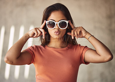 Buy stock photo Fashion, pout and sunglasses with portrait of woman on concrete wall background for eyewear style. Flirt, kiss and shades with confident or trendy person outdoor in casual clothes outfit for summer