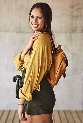 Buy stock photo Portrait of an attractive young woman posing outdoors against an urban background