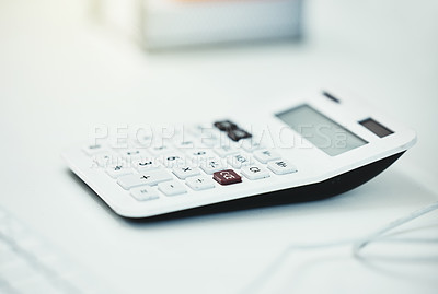 Buy stock photo Cropped shot of a calculator on a desk in an office