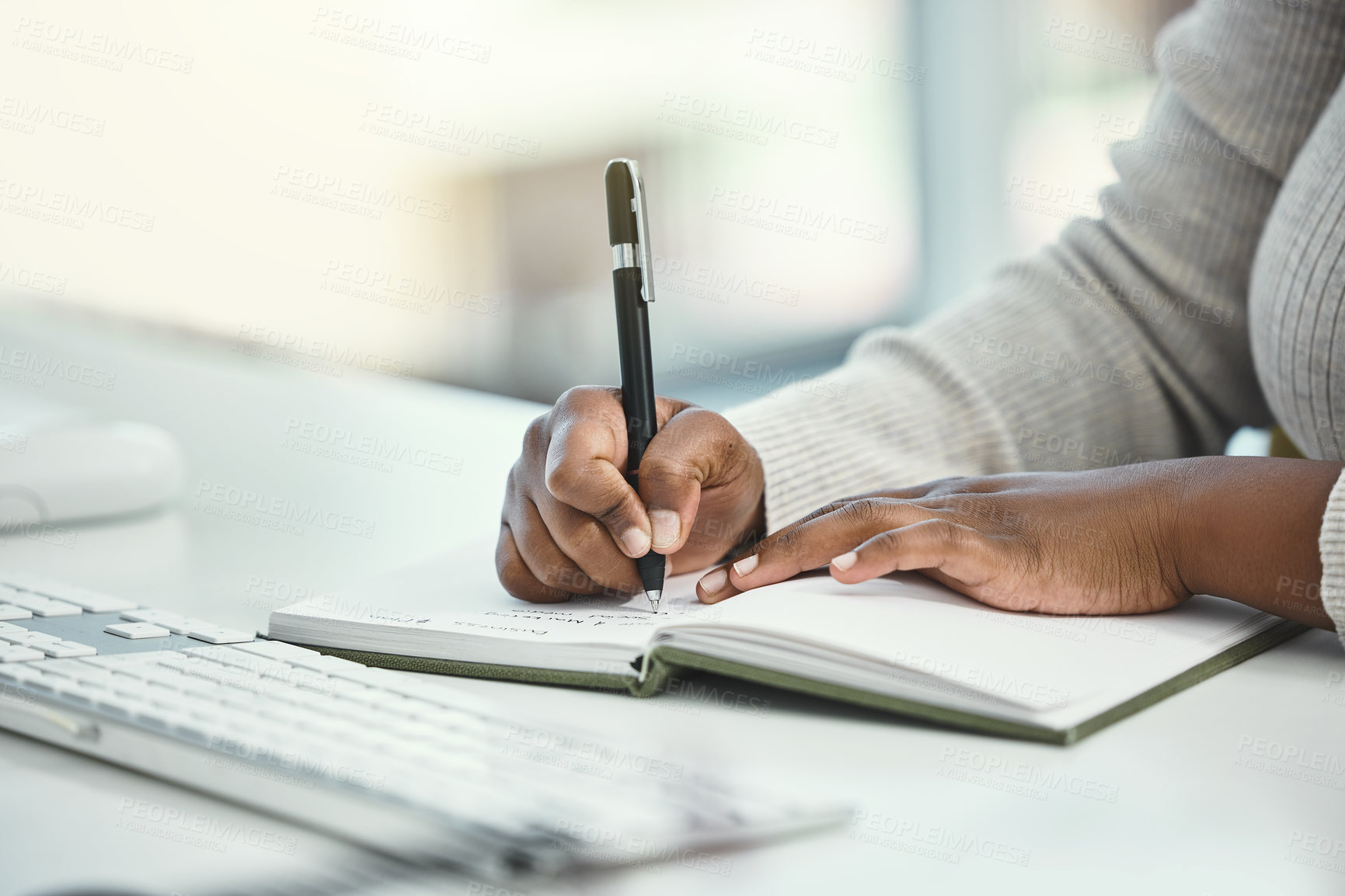 Buy stock photo Business woman, hands and writing with book for reminder, schedule planning or record keeping at office. Closeup of female person or employee taking notes for research and development at workplace