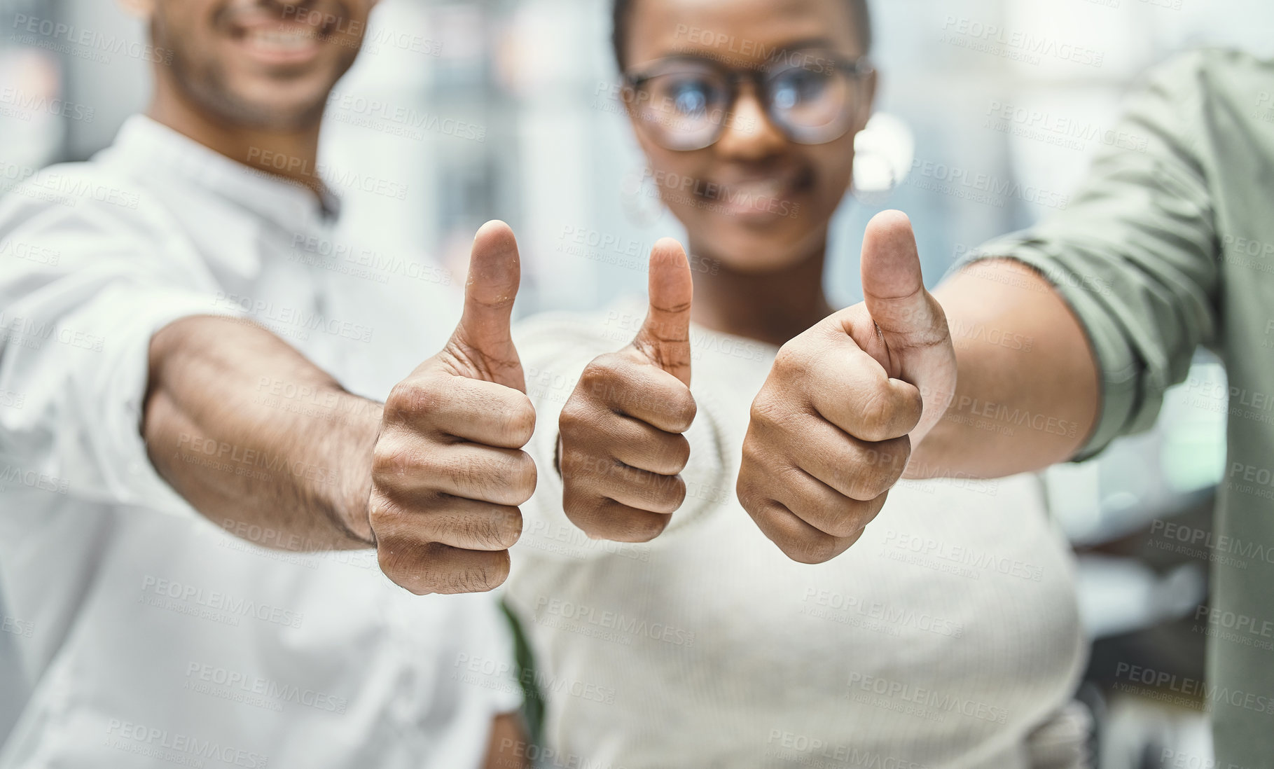 Buy stock photo Shot of three businesspeople showing thumbs up while standing together