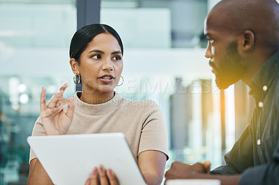 Buy stock photo Planning, colleagues in business meeting and with tablet in a office at their workplace with lens flare. Teamwork or collaboration, communication and coworkers brainstorming together at work.