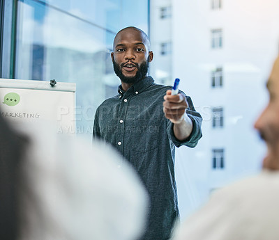Buy stock photo Shot of a businessman giving a presentation during a business meeting