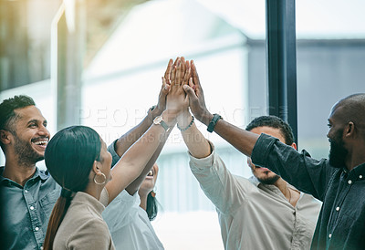 Buy stock photo Shot of a group of coworkers high fiving each other
