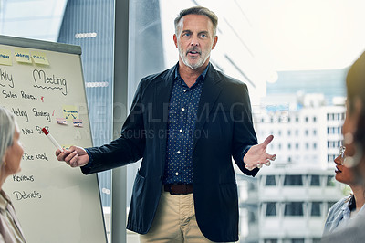 Buy stock photo Businessman, coaching and meeting on whiteboard for strategy, planning or team discussion at office. Man CEO, mentor or coach training staff in presentation for project plan or ideas at the workplace