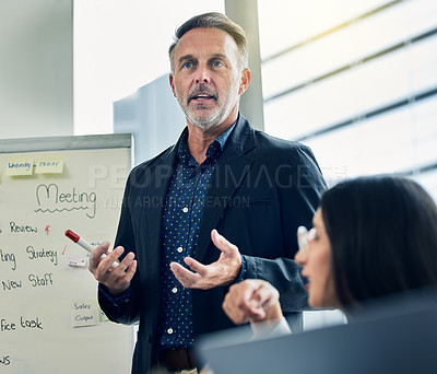 Buy stock photo Businessman, coaching and meeting on whiteboard in planning, strategy or team discussion at office. Man CEO, mentor or coach training staff in presentation for project plan or ideas at the workplace