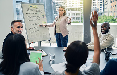 Buy stock photo Shot of a mature businesswoman giving a training presentation