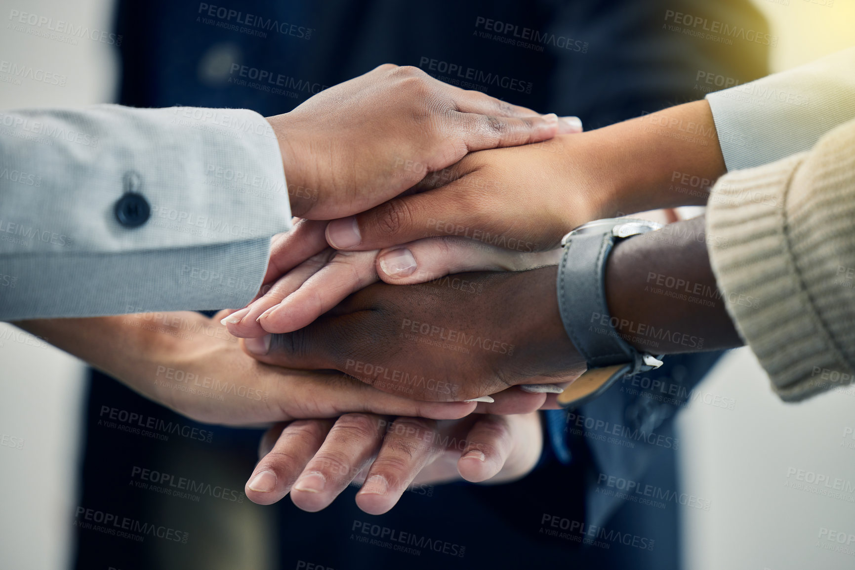 Buy stock photo Shot of business colleagues with their hands stacked at work