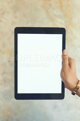 Buy stock photo Closeup shot of an unrecognisable woman holding a digital tablet with a blank screen against a wall