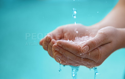 Buy stock photo Cropped shot of water flowing onto the hands of an unrecognizable person