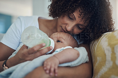 Buy stock photo Care, woman feeding her baby with bottle and in living room on the sofa at their home. Family love, drinking or nutrition and black mother feed her newborn child on couch of their house with formula