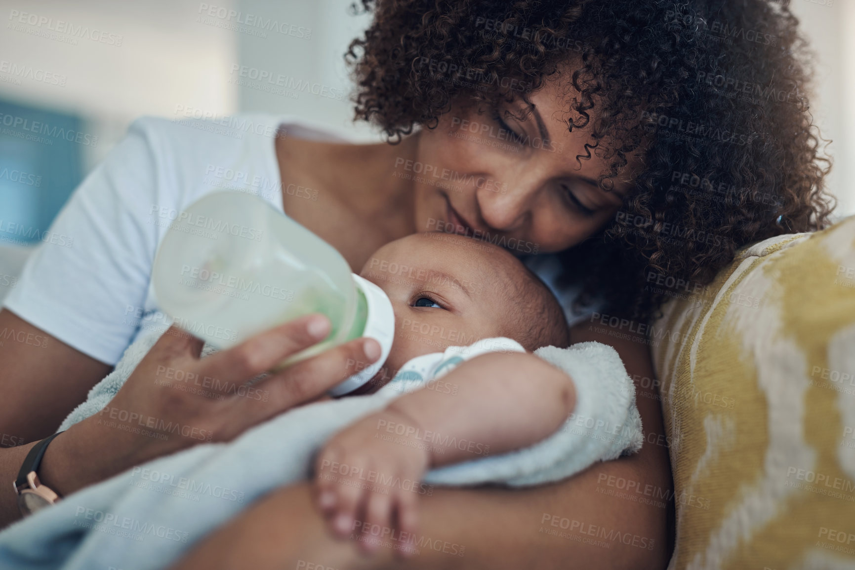 Buy stock photo Care, woman feeding her baby with bottle and in living room on the sofa at their home. Family love, drinking or nutrition and black mother feed her newborn child on couch of their house with formula