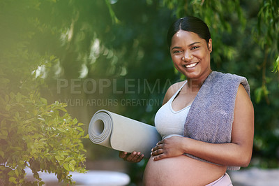 Buy stock photo Shot of a beautiful young pregnant woman standing outside with her yoga mat