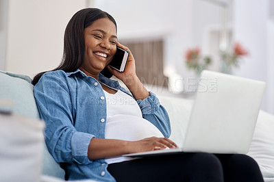 Buy stock photo Shot of a pregnant woman talking on her cellphone while sitting with her laptop