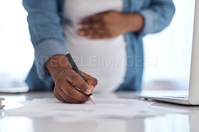 Buy stock photo Cropped shot of a pregnant woman signing documents