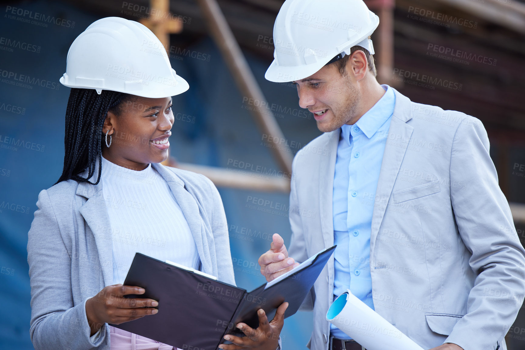 Buy stock photo Collaboration, construction and documents with engineer people outdoor on building site together. Architecture, diversity or teamwork with man and woman reading blueprint for project management
