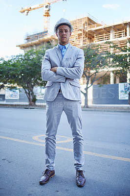 Buy stock photo Shot of a young businessman at a construction site
