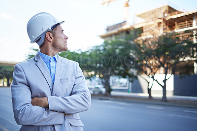 Buy stock photo Architecture, arms crossed and vision with business man outdoor on building site for project management. Construction, industry and thinking with professional engineer looking at development