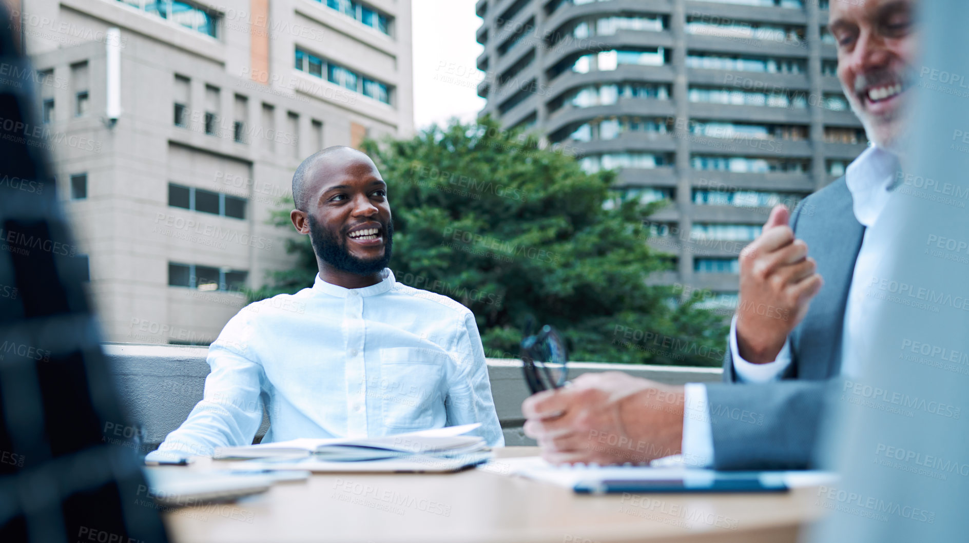 Buy stock photo Happy, black man and entrepreneur in meeting outdoor, balcony and discussion for planning, research and ideas for project development. Smile, African and leader on rooftop, brainstorming and goal 