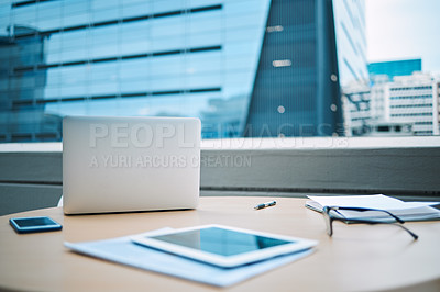 Buy stock photo Rooftop, laptop and smartphone with tablet on desk for communication, planning and research. Still life, spectacles and technology on outdoor table for ecommerce, social media and internet search