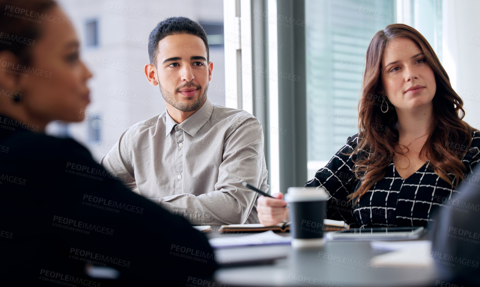 Buy stock photo Shot of a group of businesspeople having a meeting in a modern office