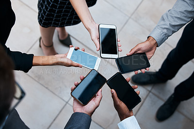 Buy stock photo Cropped shot of the hands of businesspeople using phones