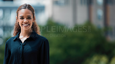Buy stock photo Shot of a young businesswoman posing against an urban background