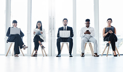 Buy stock photo Group, business people and chair with tech in queue, diversity or waiting room for hr recruitment. Men, women and technology  for interview, human resources or research for hiring, job or opportunity