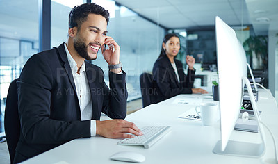 Buy stock photo Shot of a young businessman working in a call center